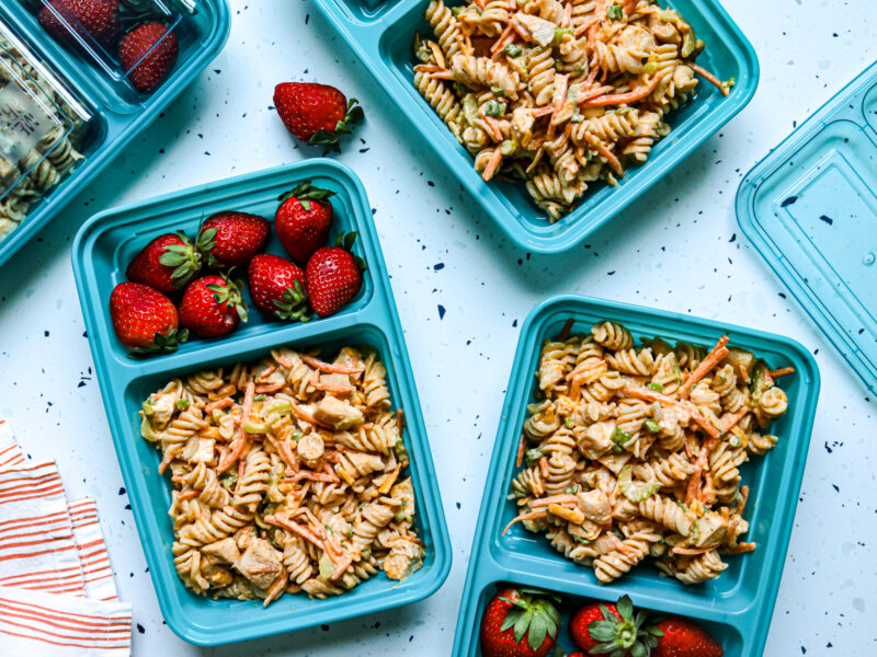Buffalo Chicken Pasta Salad Meal Prep in containers with strawberries