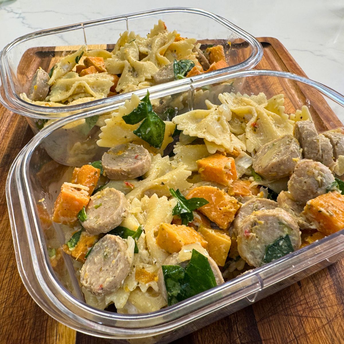 Creamy Sweetpotato Sausage Pasta in meal prep containers